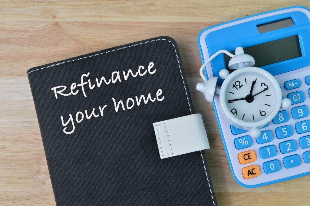 Notebook written with text REFINANCE YOUR HOME