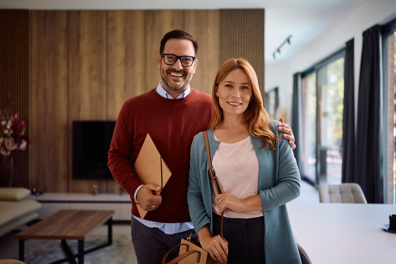 Portrait of happy new homeowners looking at camera.